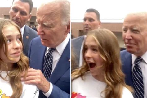 Joe Biden putting his hands on the shoulders of a young girl