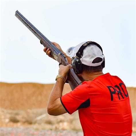 Left-handed shooter holding a handgun