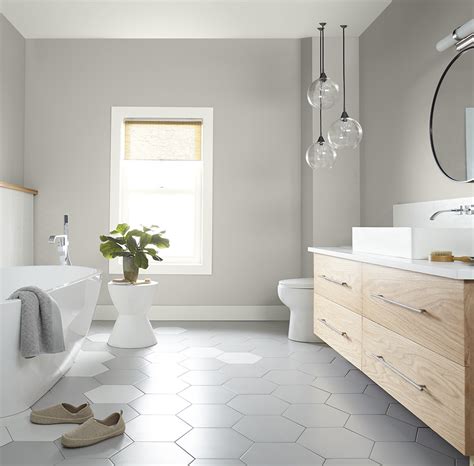 A bathroom with a light color palette