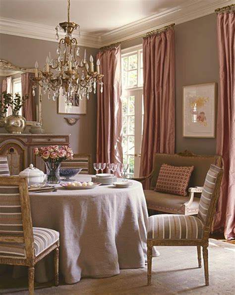 A mauve-colored dining room with a mauve-colored chandelier