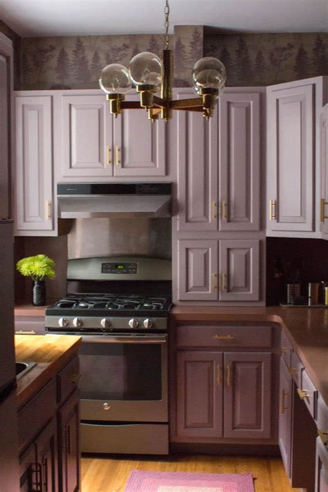 A mauve-colored kitchen with a mauve-colored island