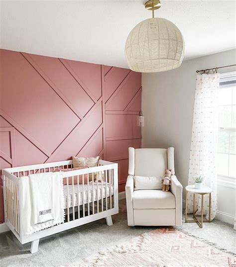 A mauve-colored nursery with a mauve-colored crib