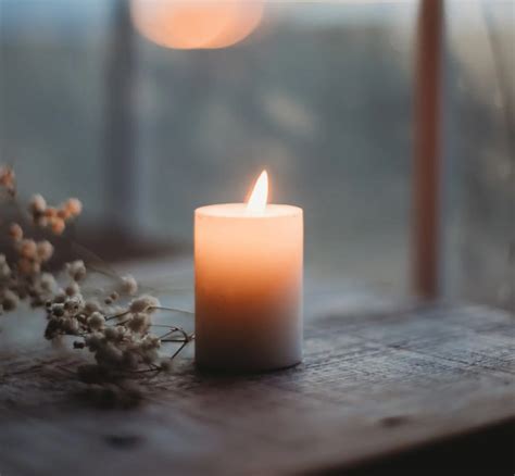 A memorial candle lit in remembrance