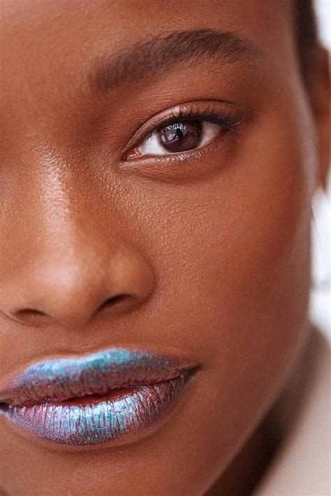 Eye look featuring metallic eyeshadow in shades of silver and gray