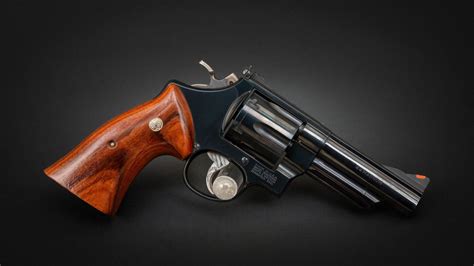 Collector holding up his Model 29 revolver