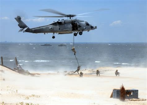 Navy SEALs in a helicopter