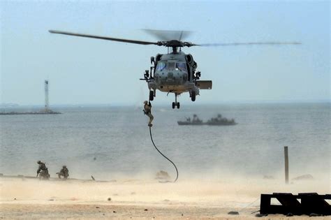 Navy SEALs in a helicopter