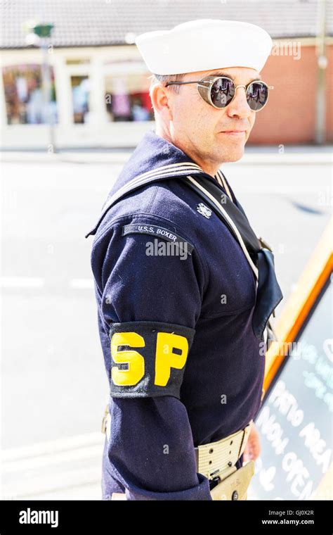 Navy Shore Patrol personnel standing at attention