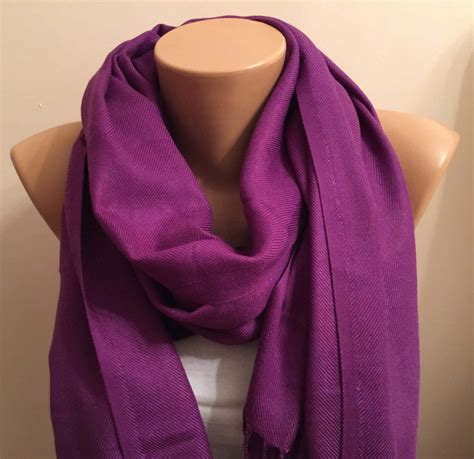 Neutral background with purple scarf