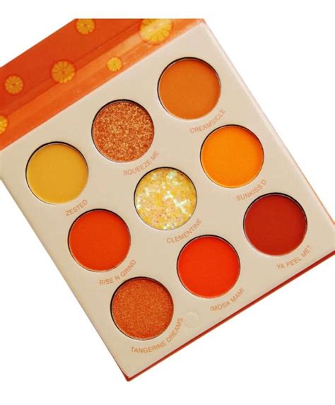 A vibrant orange eye shadow palette with 12 shades