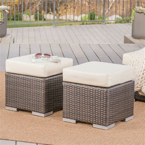 A blow up ottoman used on a patio or outdoor seating area