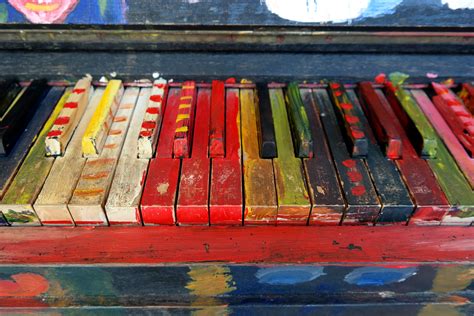 A painted palette featuring musical motifs and rhythms