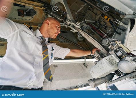 Plane Captain Inspecting Aircraft