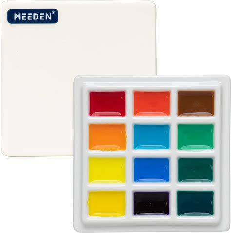 A porcelain paint palette with acrylic paints