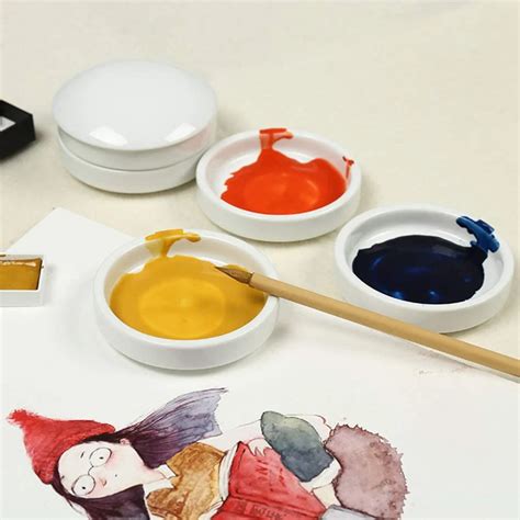 A porcelain paint palette with landscape art