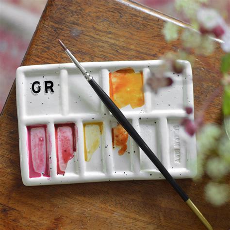 A porcelain paint palette with mixed media