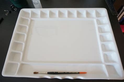 A porcelain paint palette with portrait art