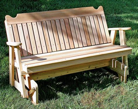 A porch glider with outdoor decor and plants