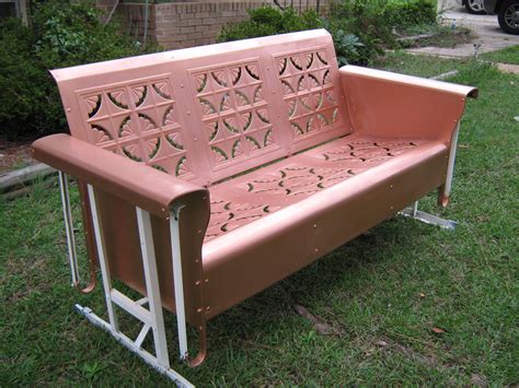 A stylish porch glider with a matching ottoman