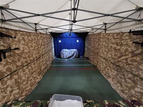 A portable shooting range set up in a backyard