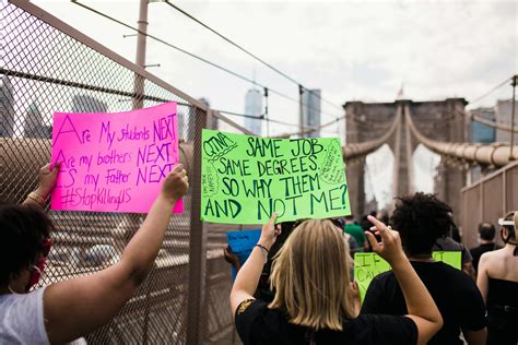 Protesters with signs outside the stadium