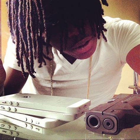 A young boy holding a toy gun, a symbol of the influence of gun violence in hip-hop culture