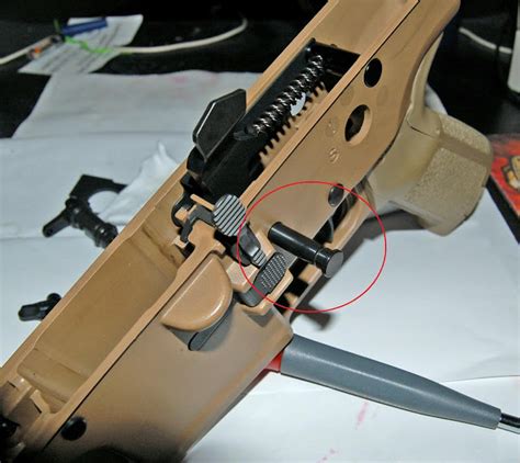 Disassembling the receiver of a rifle