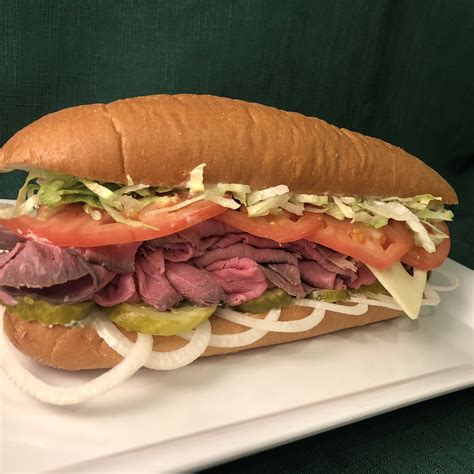 Roast beef sub sandwich with cheddar cheese and horseradish sauce