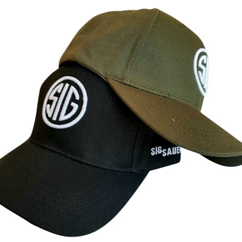 Man wearing a Sig Sauer cap with a graphic t-shirt