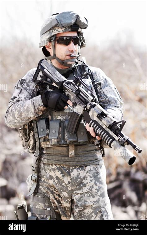 Soldier with gun in desert environment