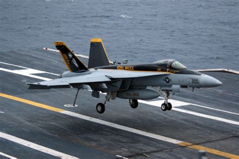 VFA-27 F/A-18E Super Hornet on the flight deck of an aircraft carrier