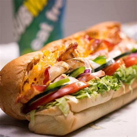 A sub sandwich with fresh vegetables