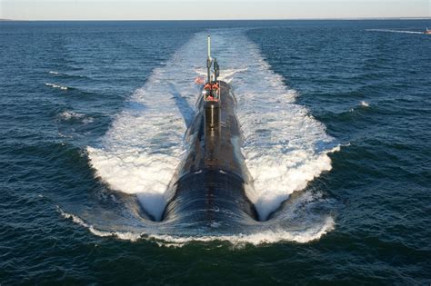 A submariner checks the navigation system