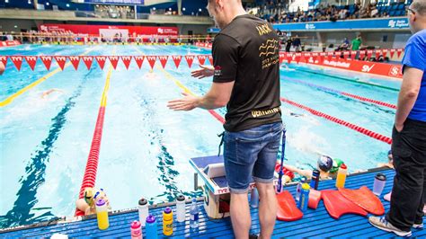 Swimming coach giving instructions