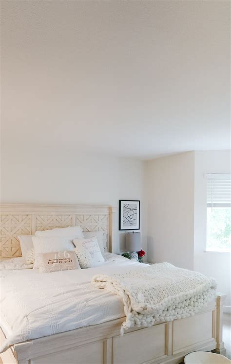 Swiss Coffee bedroom walls with white furniture and natural textures