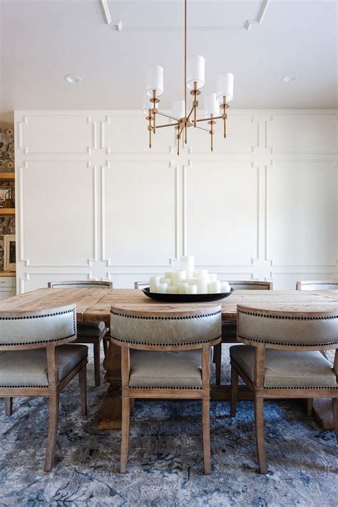 Swiss Coffee dining room walls with dark furniture and industrial accents