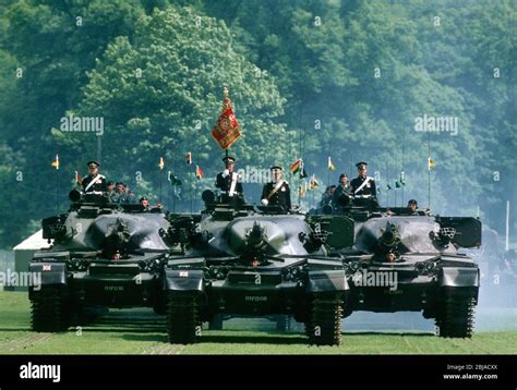 Crowd Watching a Tank in a Fourth of July Parade