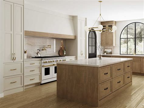 A kitchen with taupe-colored walls and cream-colored cabinets