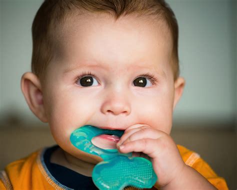 Teething baby smiling