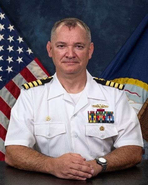 A photo of Timothy Kennedy at the helm of his boat