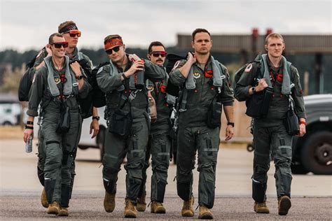 Top Gun pilots performing maintenance and inspection