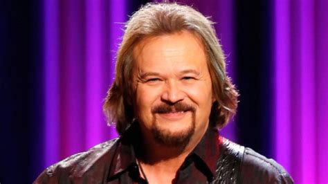 Travis Tritt performing on stage