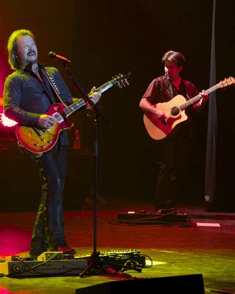 Travis Tritt performing on stage