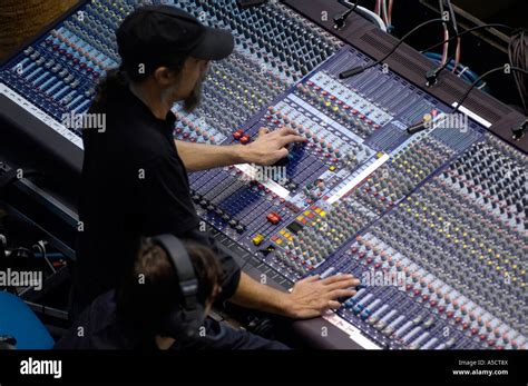 Donald Trump receiving feedback from an audio technician