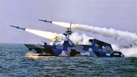 Type 022 missile boat with other naval vessels