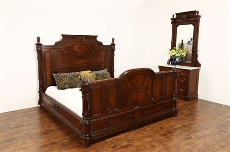 A photograph of a Victorian-era piece of furniture featuring intricate carvings and upholstery