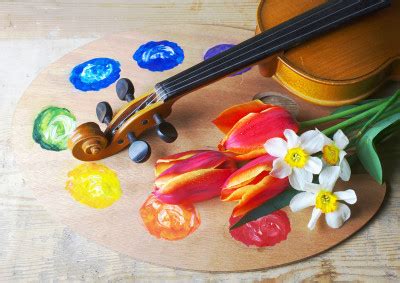 A violin and palette side by side, with a blue and yellow color scheme