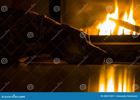 An image of a warm and cozy living room with sepia tones