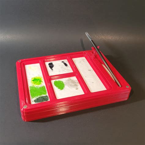 A wet palette with separate compartments for paints and inks