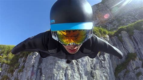 Wingsuit flying over a mountain